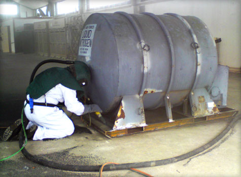 6. Gritblast preparation for tank coating.