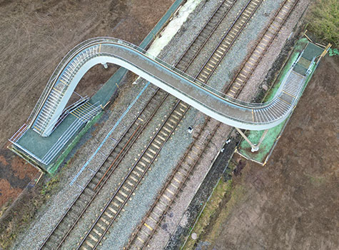 Sui Generis International provide bespoke FRP components UK railway footbridge.