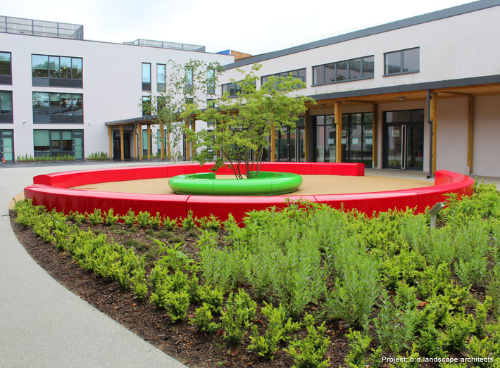 Bright red Arena and zingy green Corona shaped seats put together a striking 'eye' design in the centre of the school's new-look courtyard.