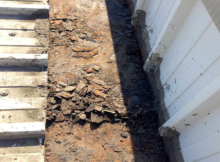 Before GRP lining: work begins with gutter clearance and investigation into the current state of the gutters.